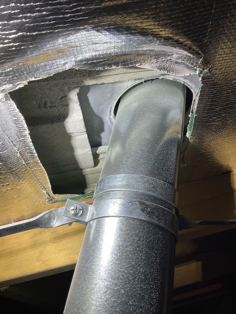 Hot flue sarking non compliant, recorded during a lock-up inspection in Truganina