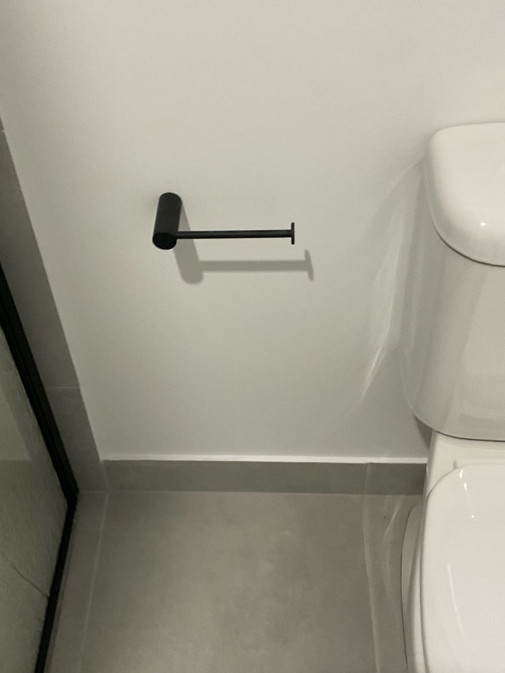 Loose toilet roll holder, recorded during a pre-purchase inspection in Truganina