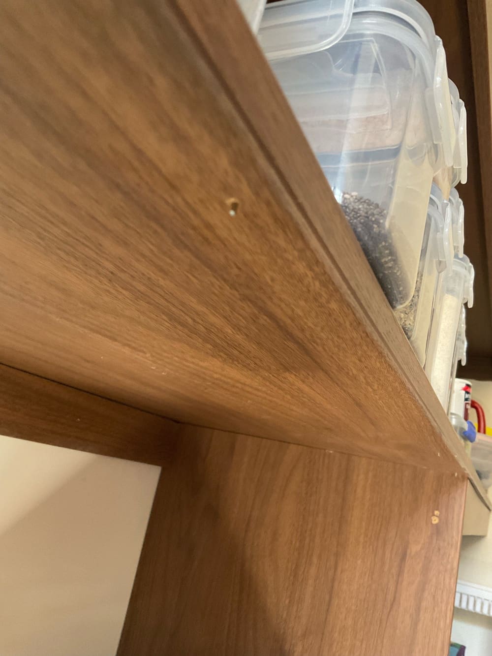 Nails protruding past cabinetry multiple locations, recorded during a fixing inspection in Truganina